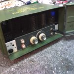 Bell and Howell Projector amp installed in a WWII ammo case. Record level lights active with signal